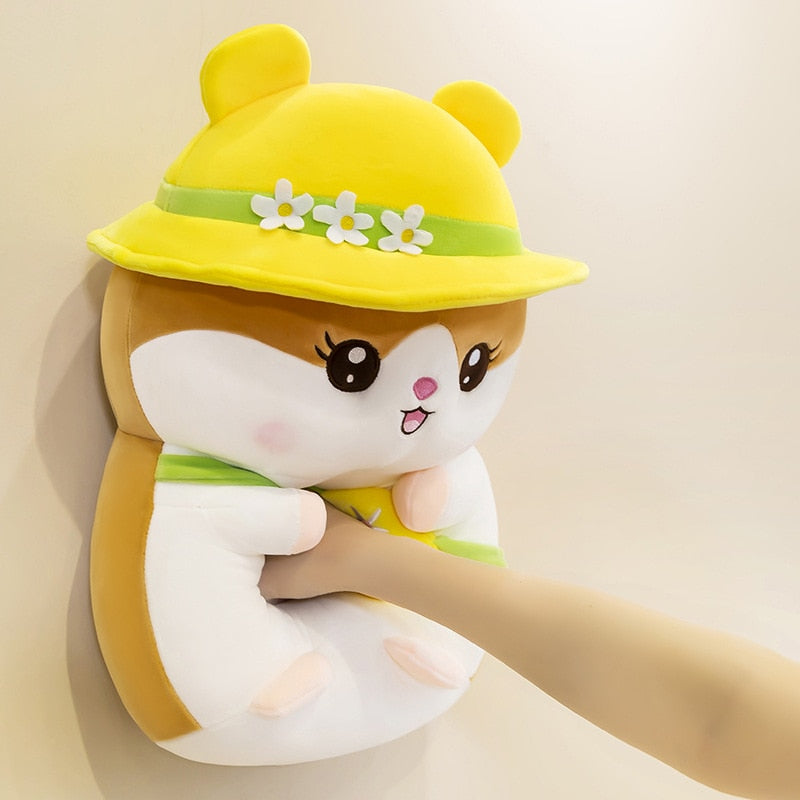 woman punching a yellow Kawaii Hamster Stuffed Animal