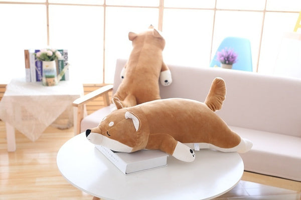 two giant shiba inu plush in a sofa