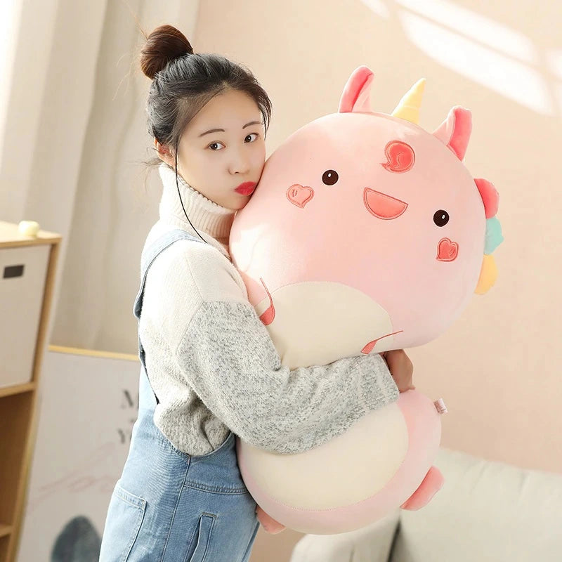 woman hugging a kawaii unicorn squishmallows plush