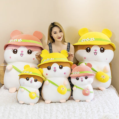 woman sitting beside multiple design of Kawaii Hamster Stuffed Animal