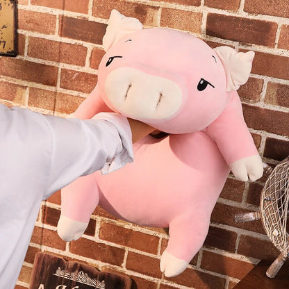 Woman punching a squishy piggy stuffed animal