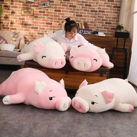Woman with different sizes of squishy piggy stuffed animal