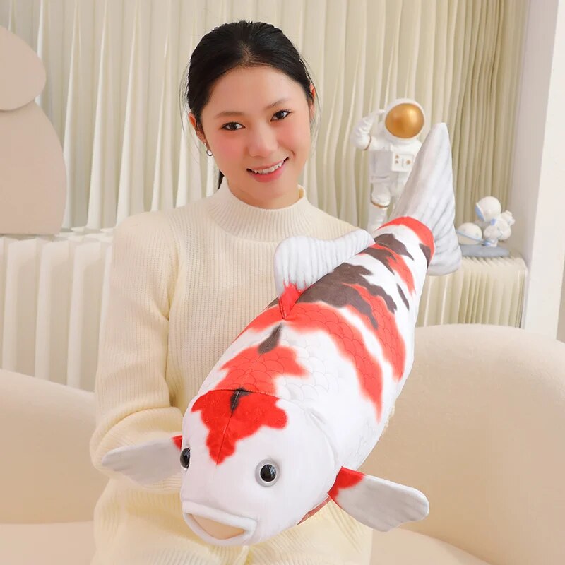 woman carrying a koi fish plush