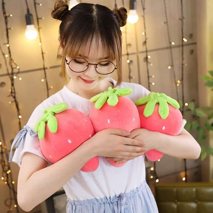 Woman hugging 3 cute pink strawberry soft pillow