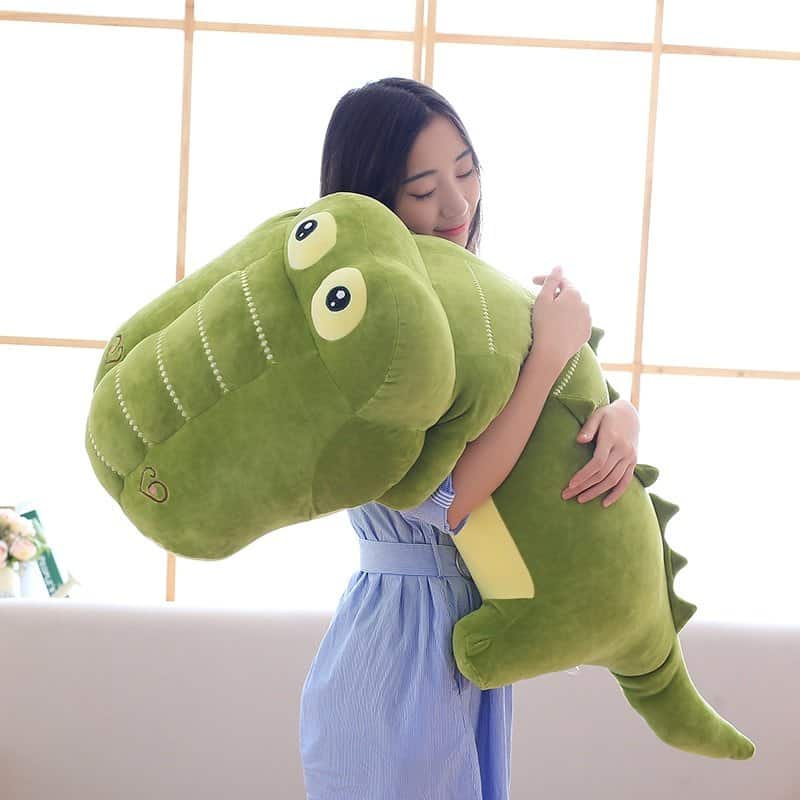 woman hugging a kawaii giant stuffed alligator toy