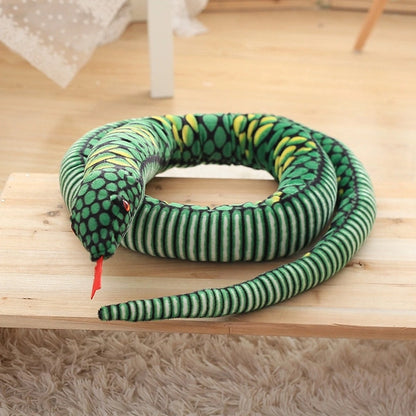 green giant snake stuffed animal toy in a table
