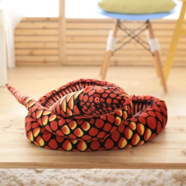 red giant snake stuffed animal toy in a table