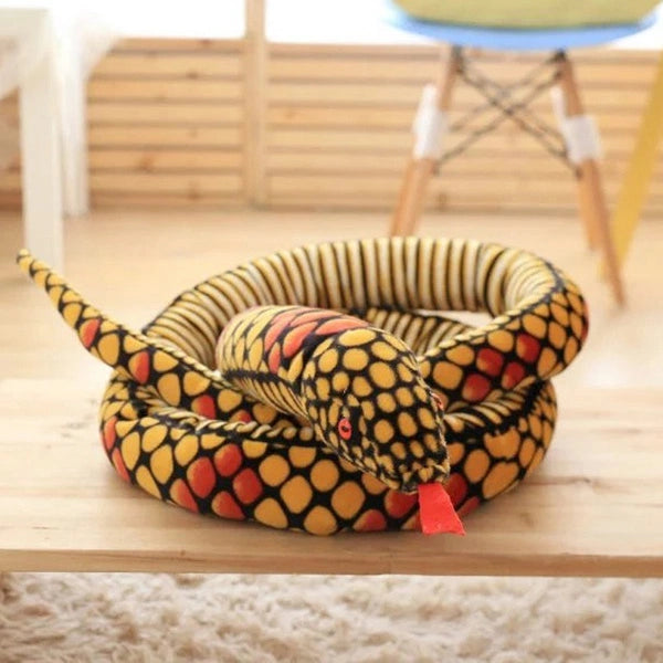 yellow giant snake stuffed animal toy in a table