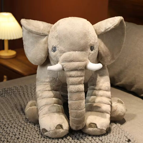 Front view of a grey baby elephant stuffed animal sitting.