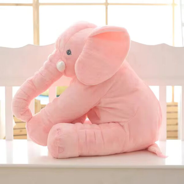 A pink baby elephant stuffed animal sitting.