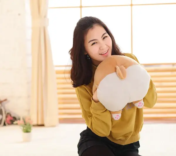 woman-hugging-a-corgi-butt-plush-pillow