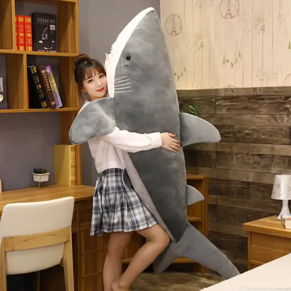 woman-hugging-a-gray-shark-plush-toy