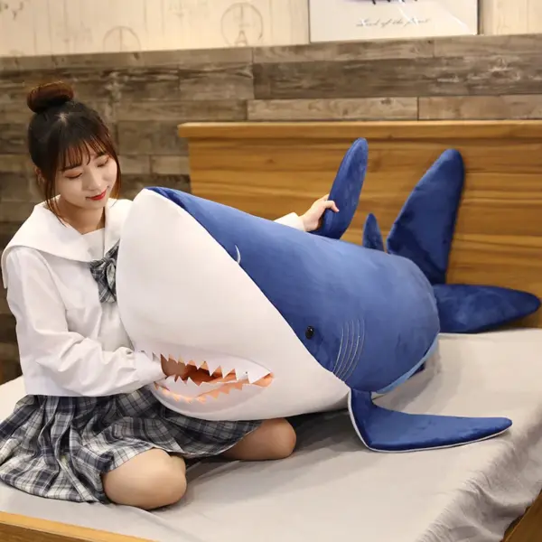 woman-touching-the-teeth-of-shark-plush-toy