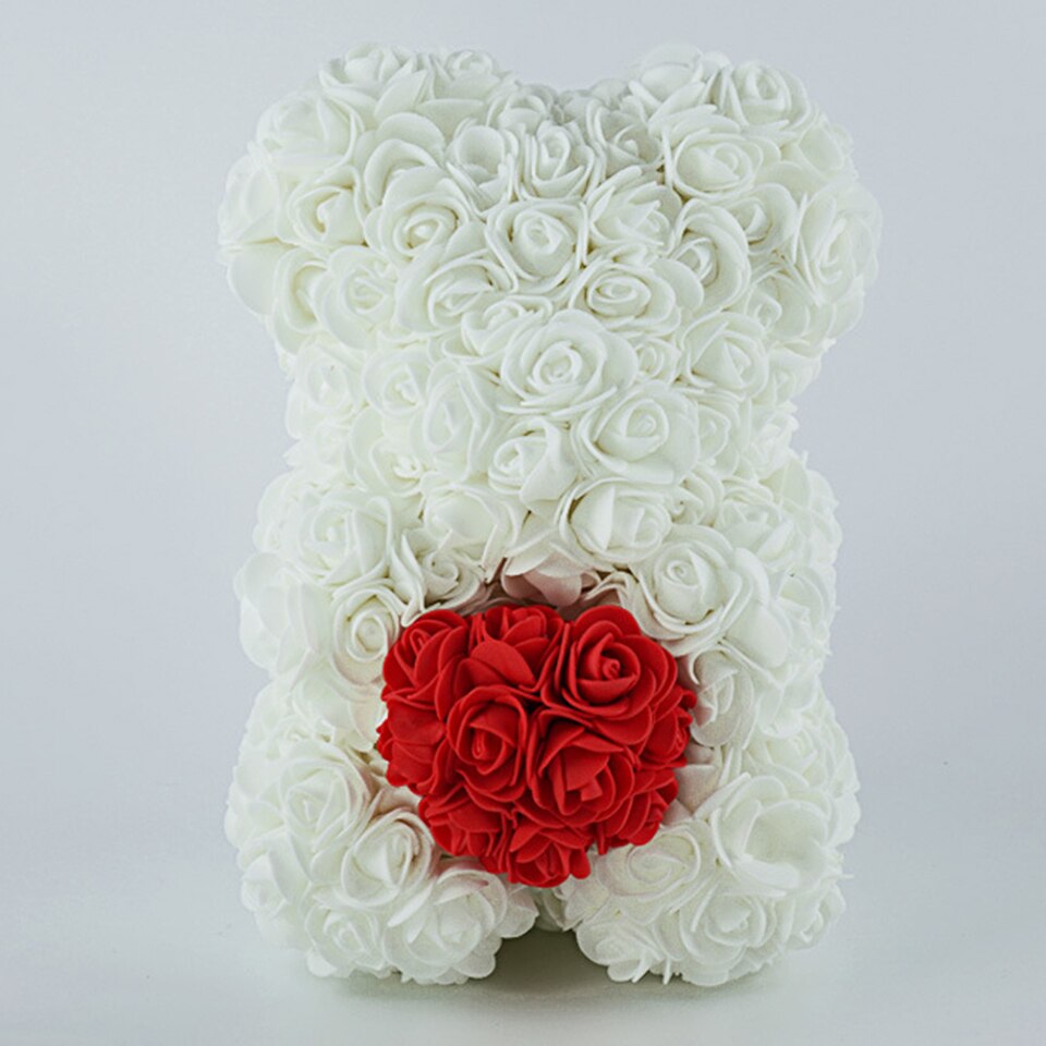 White rose teddy bear with heart — tender gift for baby shower