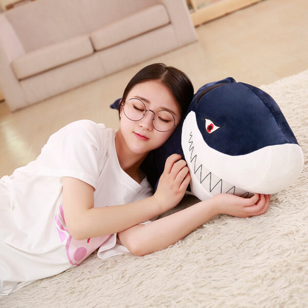 Woman sleeping in a Giant Shark Plush