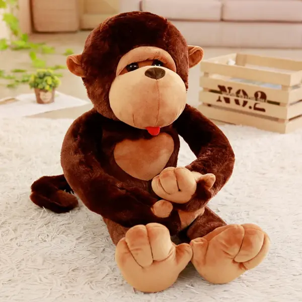 Giant brown monkey stuffed animal plush sitting on a white carpet in a cozy room.