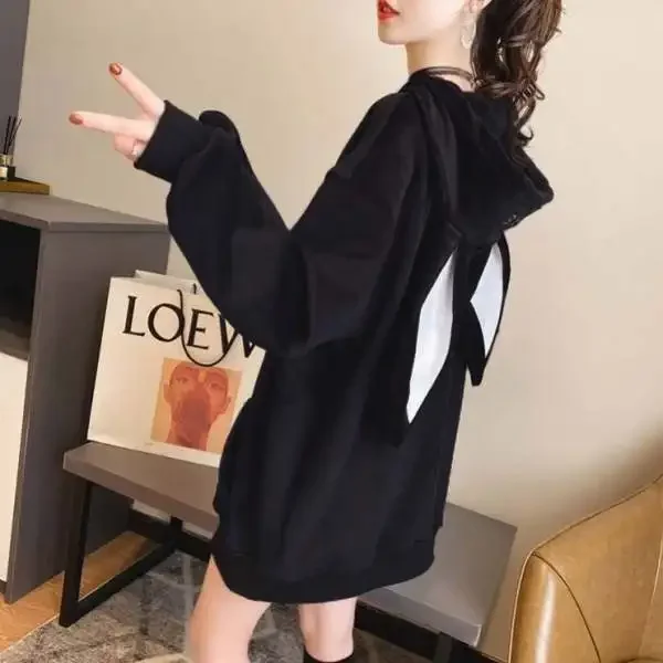 Plush black bunny hoodie with attached ears and roomy front pocket