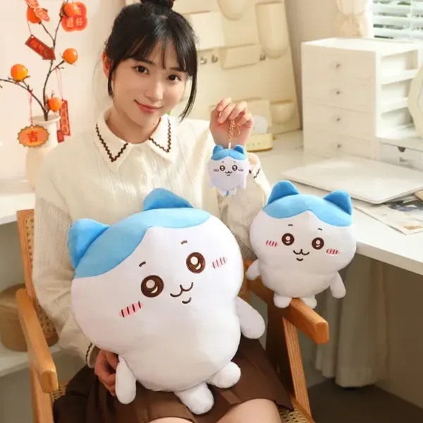 Woman Holding two sizes of Hachiware Plush