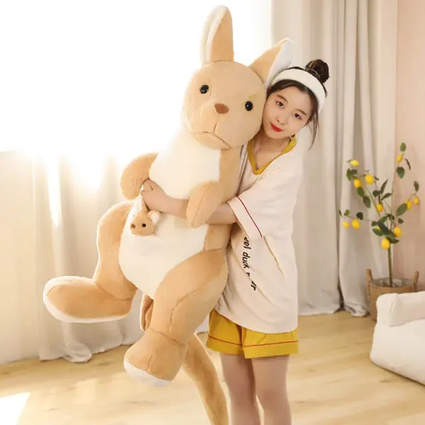 Woman lifting a Brown Kangaroo Stuffed Animal