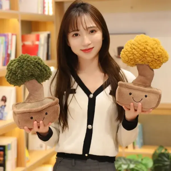 Woman holding two money tree plushies