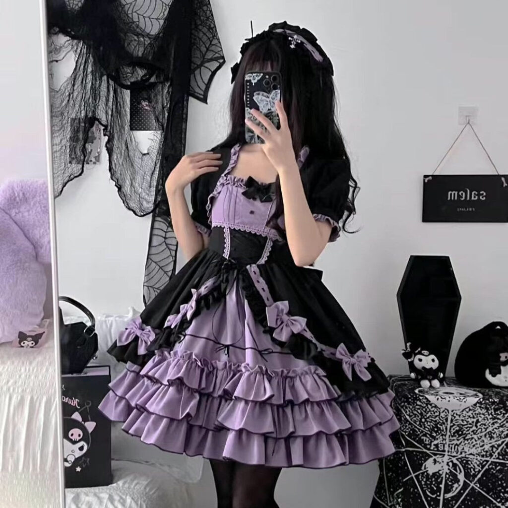 Pastel goth maiden dress in black and lavender with ruffles and bows
