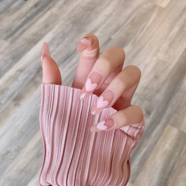 Dolly kawaii press-on nails with bows and butterfly gems — pastel pink